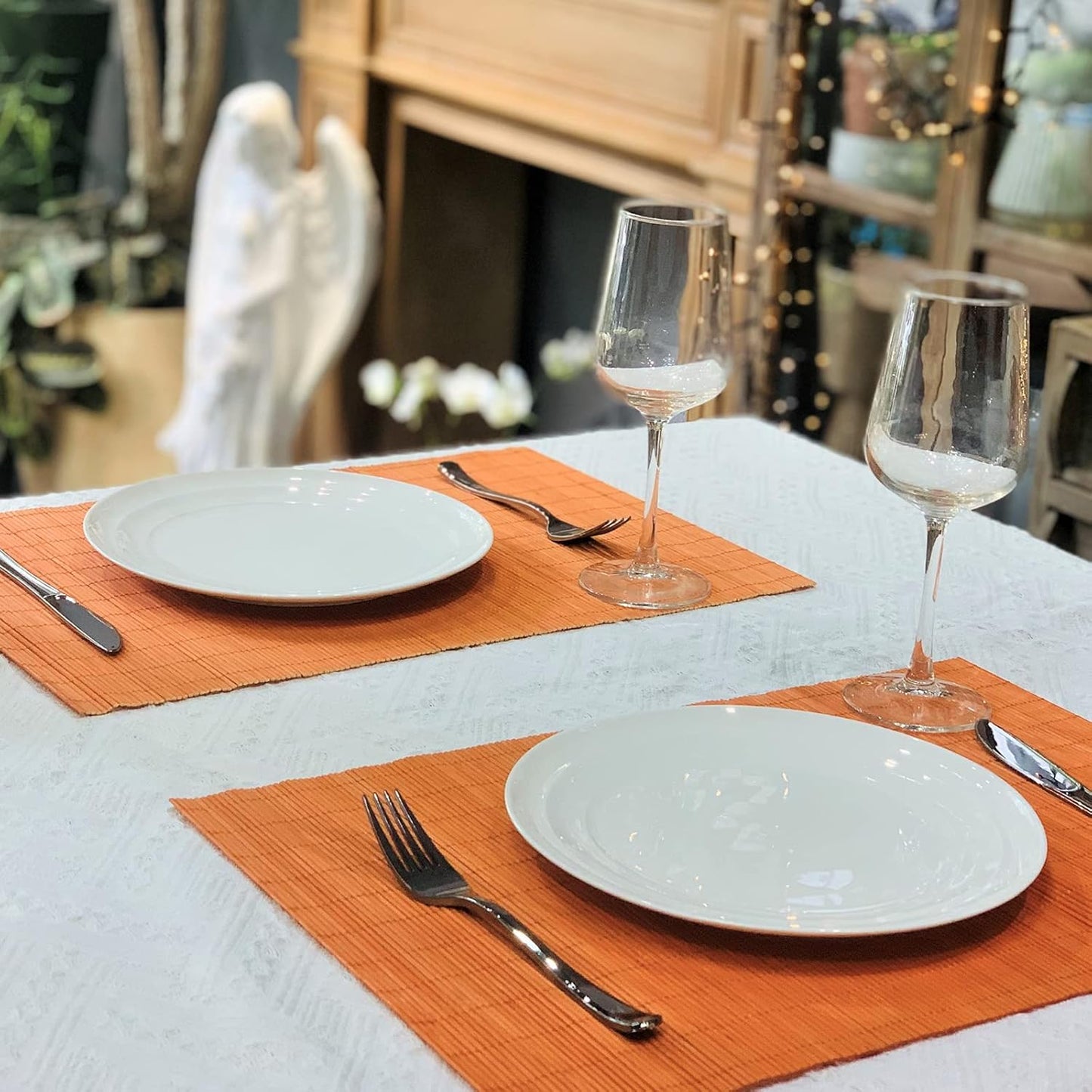 ANDSTAR Non-Slip Waterproof Placemats Set of 6 - Reusable Wipeable Table Mats for Dining Table, Kitchen, Outdoor Picnic, 12x18 Inch PVC Backed Heat Resistant Place Mats Dishwasher Safe（Orange）